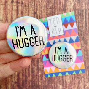 I’m A Hugger Holo Rainbow Button Badge